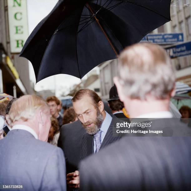 Eldon Square Shopping Centre, Newgate Street, Newcastle upon Tyne, . Prince Michael of Kent under an umbrella at the official opening of the food...