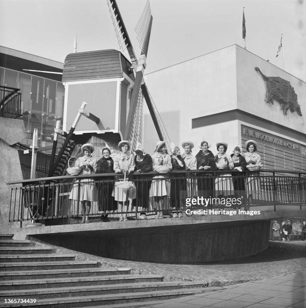 Bull Ring Centre, Birmingham, . A group of Dutch women in traditional dress posed outside the Bull Ring Centre, on the opening day of the 'Holland is...