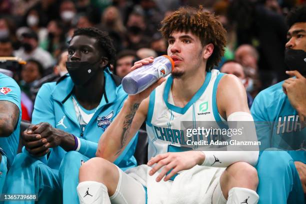 LaMelo Ball of the Charlotte Hornets drinks Gatorade on the bench during a game against the Boston Celtics at TD Garden on January 19, 2022 in...