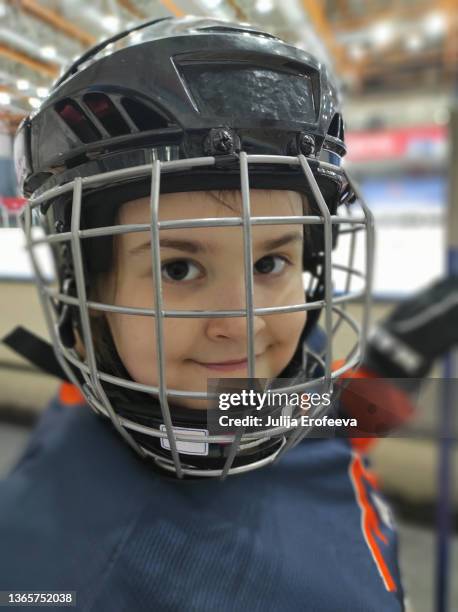 girl hockey player on the hockey arena - goaltender ice hockey player stock-fotos und bilder