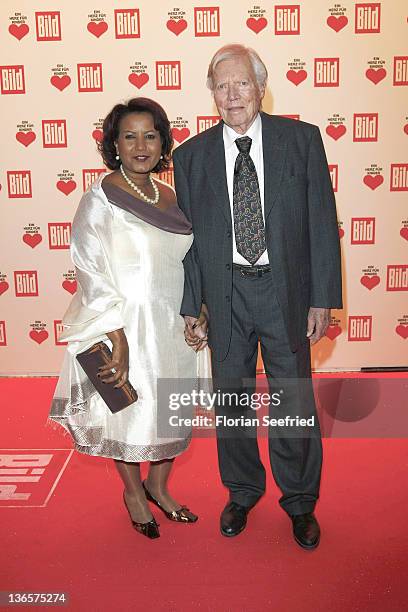 Actor Karlheinz Boehm and his wife Almaz Boehm attend the 'Ein Herz fuer Kinder' Charity Gala at Axel Springer Haus on December 18, 2010 in Berlin,...