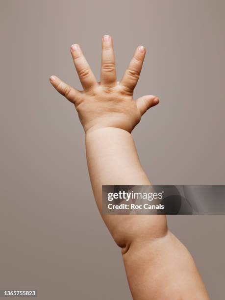 baby hand - human limb stock pictures, royalty-free photos & images