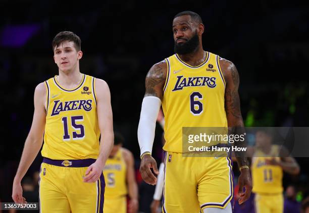 LeBron James and Austin Reaves of the Los Angeles Lakers walk back to the court after a timeout during a 111-104 Indiana Pacers win at Crypto.com...
