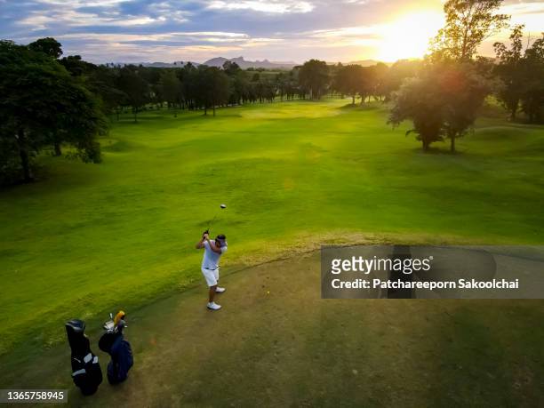 to the winningscore - golf swing sunset stock pictures, royalty-free photos & images