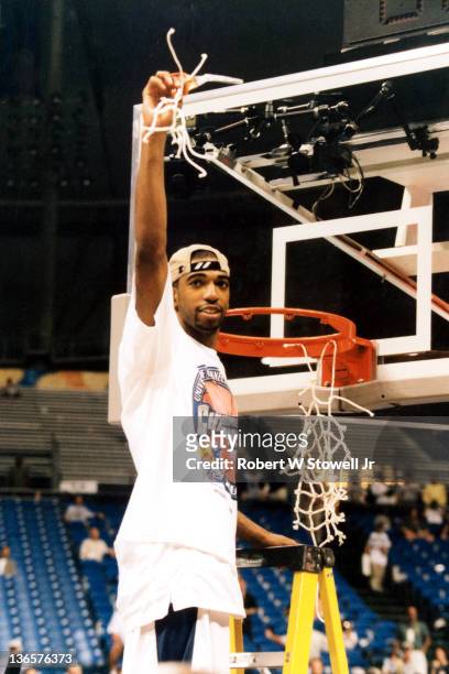 UConn's Richard 'Rip' Hamilton cuts down the nets after defeating Duke to win the 1999 NCAA championship, St. Petersburg Florida, 1999.