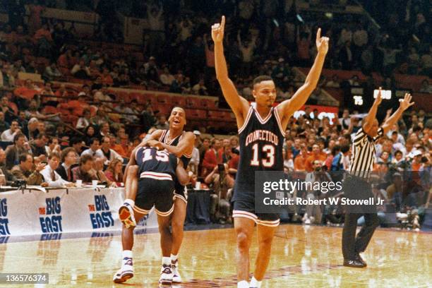 The University of Connecticut's men's basketball team celebrates after winning the Big East basketball tournament, New York, 1990.