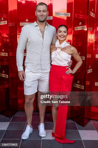 Tom Bellchambers and Olympia Valance attend day 4 of the 2022 Australian Open at Melbourne Park on January 20, 2022 in Melbourne, Australia.