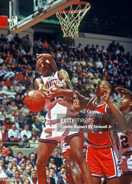 UConn's Rod Sellers is fouled by Syracuse's Derrick Coleman, Hartford CT 1990.