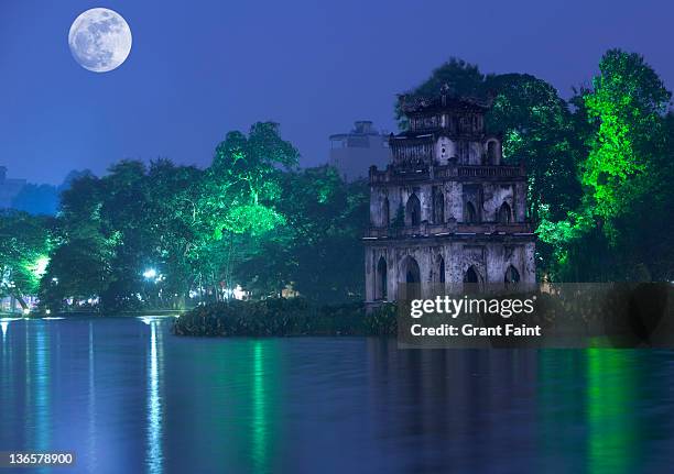 moonrise over lake . - hanoi night stock-fotos und bilder