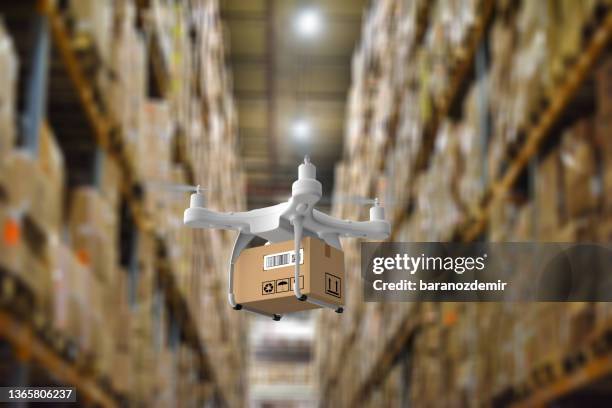 delivery drone in warehouse - drones stock pictures, royalty-free photos & images