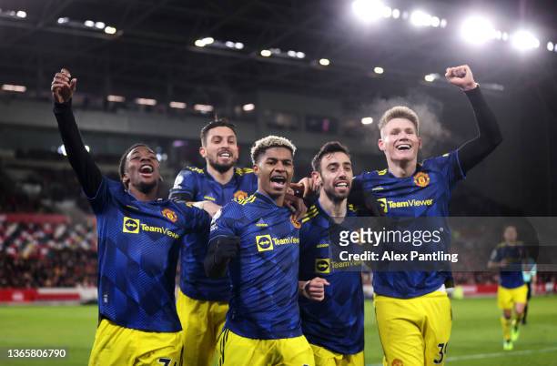 Marcus Rashford of Manchetser United celebrates with team mates Anthony Elanga, Alex Telles, Bruno Fernandes and Scott McTominay during the Premier...