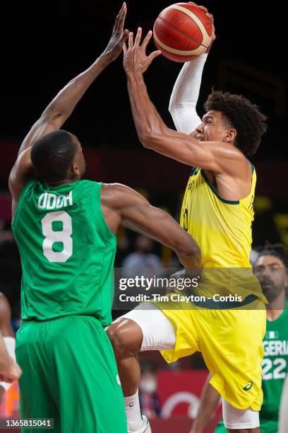 Matisse Thybulle of Australia drives to the basket defended by Ekpe Udoh of Nigeria during the Australia V Nigeria basketball preliminary round match...