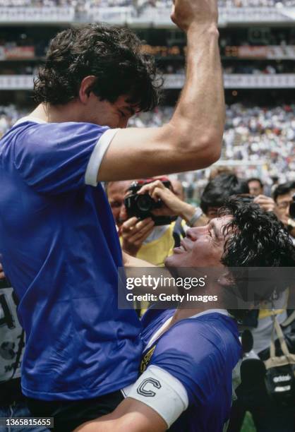 Argentina player Diego Maradona celebrates with a team mate after the FIFA 1986 World Cup Quarter Final match between Argentina and England on June...