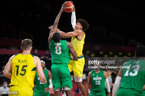 Matisse Thybulle of Australia drives to the basket defended by Ekpe Udoh of Nigeria during the Australia V Nigeria basketball preliminary round match...