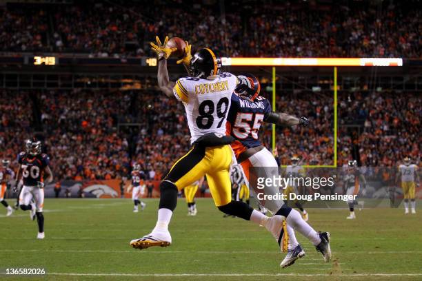 Jerricho Cotchery of the Pittsburgh Steelers catches a touchdown pass to tie the game in fourth quarter against D.J. Williams of the Denver Broncos...