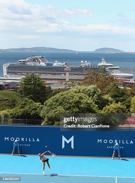 Casey Dellacqua of Australia serves in her match against Galina Voskoboeva of Kazakhstan during day two of the 2012 Hobart International atDomain...