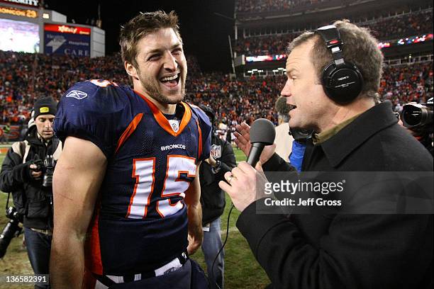 Tim Tebow of the Denver Broncos talks to the media after defeating the Pittsburgh Steelers in overtime of the AFC Wild Card Playoff game at Sports...