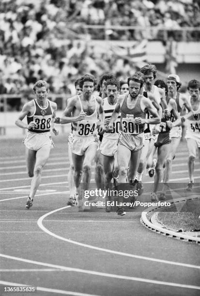 Eventual gold medal winner Lasse Viren of Finland leads Brendan Foster of Great Britain in the final of the Men's 5000 metres event at the 1976...