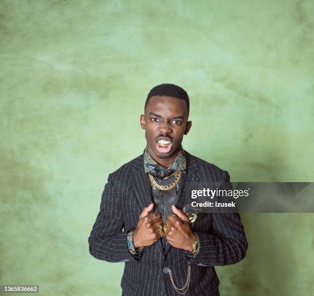 glamour portrait of bossy young man - capped tooth imagens e fotografias de stock