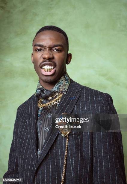 glamour portrait of bossy young man - tooth cap stock pictures, royalty-free photos & images