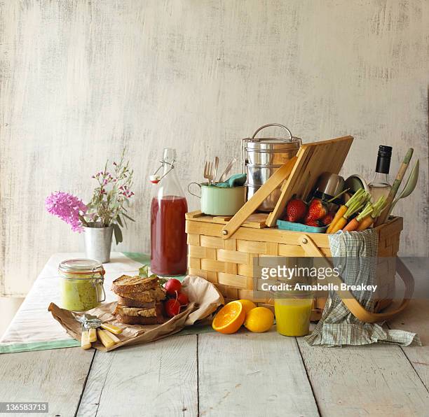 picnic basket with food and flowers - picnic basket stock pictures, royalty-free photos & images