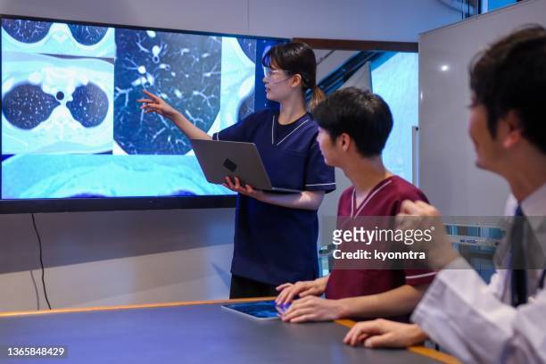 medical professionals discussing in a conference room - medical technology stock pictures, royalty-free photos & images