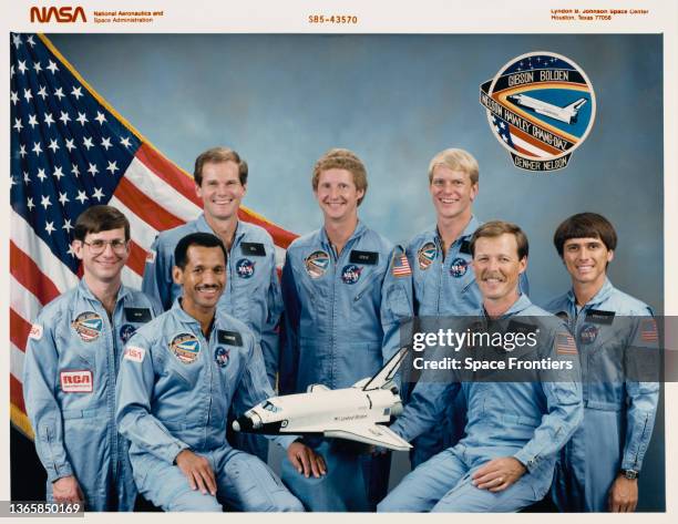 Crew portrait with a model of the Space Shuttle Columbia, at Johnson Space Center in Houston, Texas, 25th October 1985. The primary objective of...