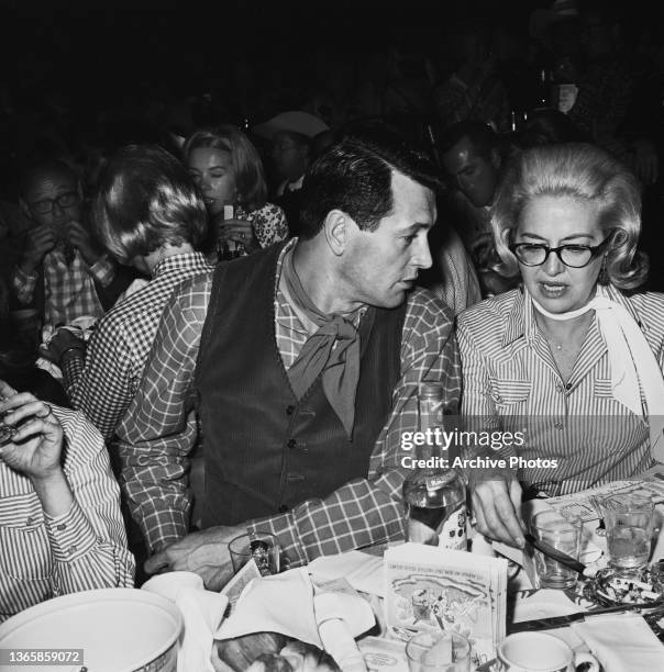 American actors Rock Hudson and Marilyn Maxwell at a SHARE Boomtown benefit party, USA, 1964.