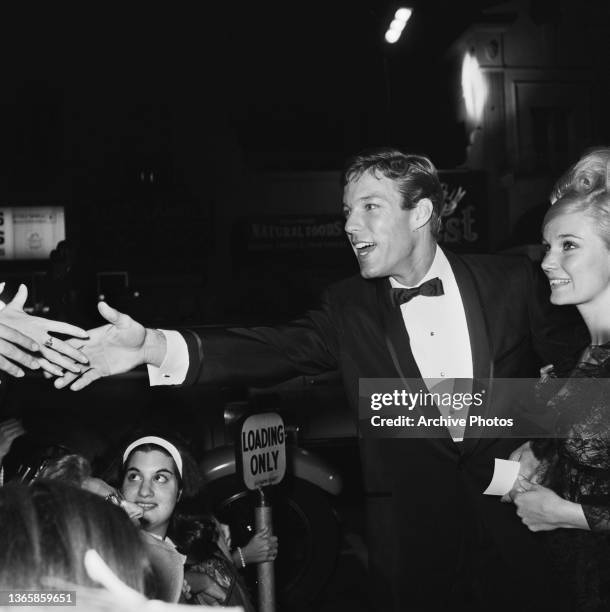 American actor Richard Chamberlain and actress Yvette Mimieux at the premiere of the film 'The Unsinkable Molly Brown' in Hollywood, USA, 1964.