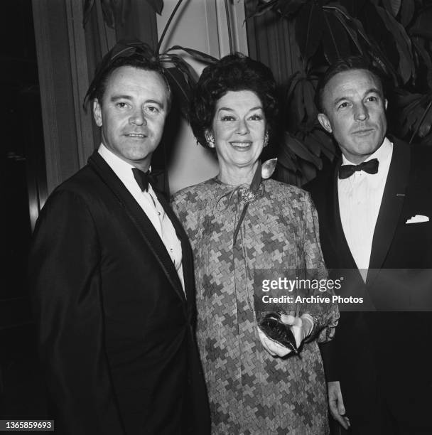 From left to right, actors Jack Lemmon, Rosalind Russell and Gene Kelly attend the premiere of 'The Train' at the Los Angeles County Museum of Art,...