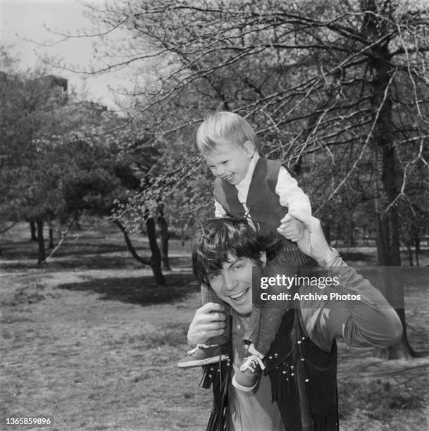 American actor Michael Hawkins and his son, future actor Christian Slater in Central Park, New York City, USA, circa 1971.