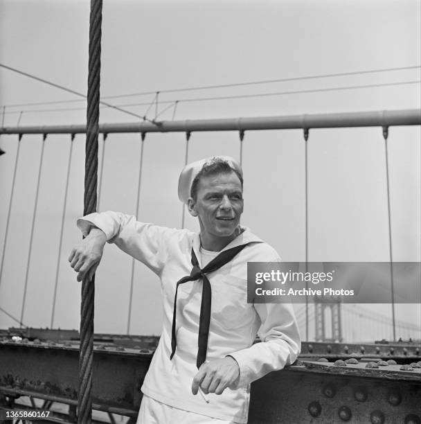 American singer and actor Frank Sinatra poses on Brooklyn Bridge during the filming of the movie 'On The Town' in New York City, USA, 1949.