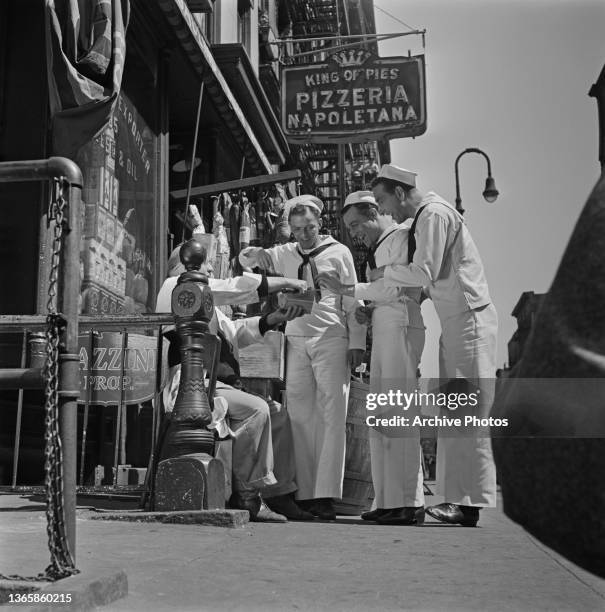 From left to right, actors and singers Frank Sinatra, Gene Kelly and Jules Munshin film a scene for the movie 'On The Town' in New York City, USA,...