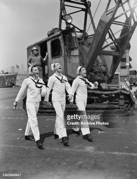 From left to right, actors Frank Sinatra, Jules Munshin and Gene Kelly dressed as sailors in New York City, USA, in the musical film 'On The Town',...