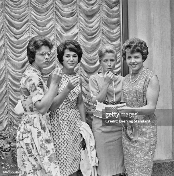 American tennis players Billie Jean Moffitt , Jane Albert, Sue or Susan Behlmar and Carole Caldwell share a box of chocolates at the Wimbledon...