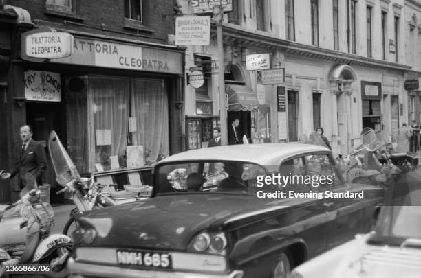 The Trattoria Cleopatra and other establishments on Greek Street in Soho, London, UK, 6th May 1963.
