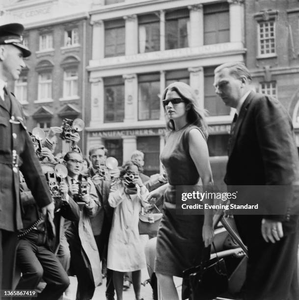 Christine Keeler outside the Central Criminal Court in London, whilst appearing as a witness in the trial of osteopath Stephen Ward, UK, 24th July...