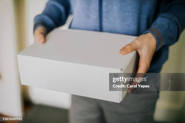 cropped hand of person holding box - white box packaging stock pictures, royalty-free photos & images