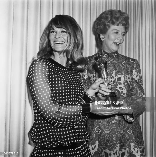 British actress Julie Christie presents the award for Best Actor to actress Wendy Hiller at the 39th Academy Awards at the Santa Monica Civic...