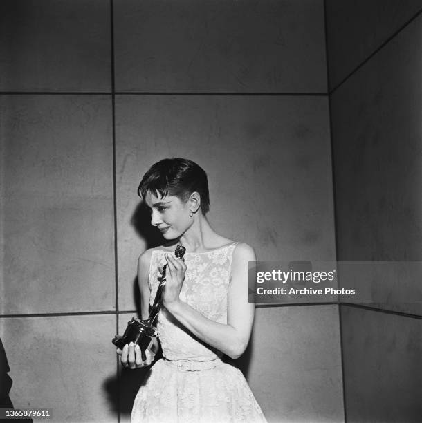 Actress Audrey Hepburn accepts the award for Best Actress for her role in the film 'Roman Holiday' at the 26th Academy Awards at the NBC Century...