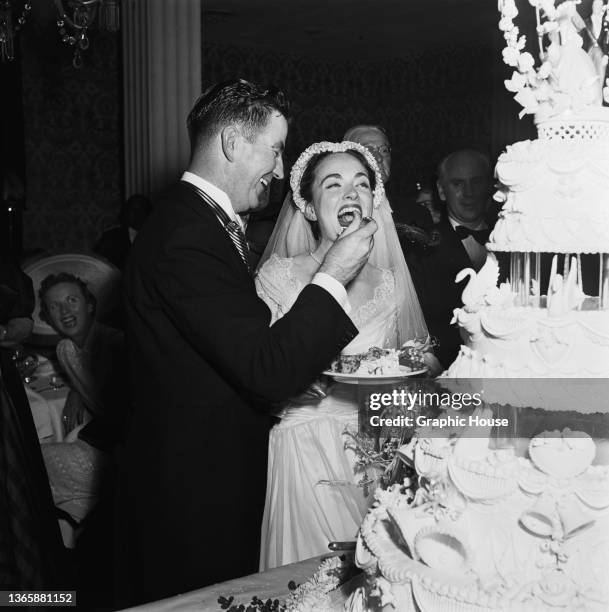 American actress Ann Blyth during her wedding reception in California, USA, 27th June 1953. On the left is her husband, obstetrician James McNulty.