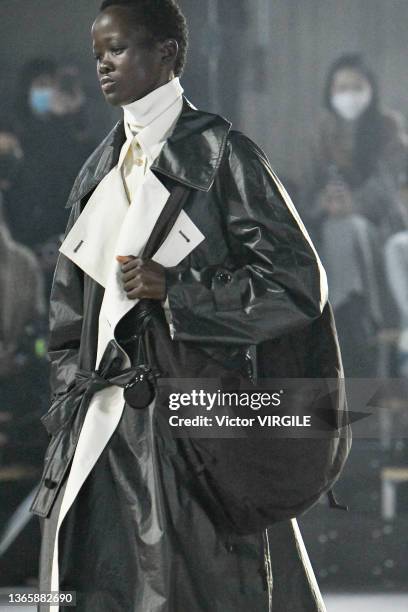 Model walks the runway during the Lemaire Ready to Wear Fall/Winter 2022-2023 fashion show as part of the Paris Men Fashion Week on January 19, 2022...