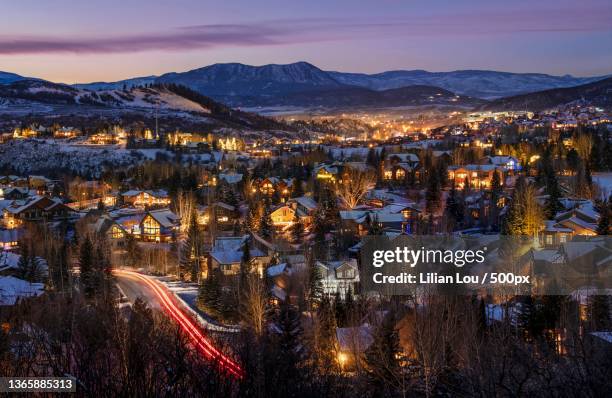 ski town,high angle view of illuminated city against sky at night,steamboat springs,colorado,united states,usa - steamboat springs colorado photos et images de collection