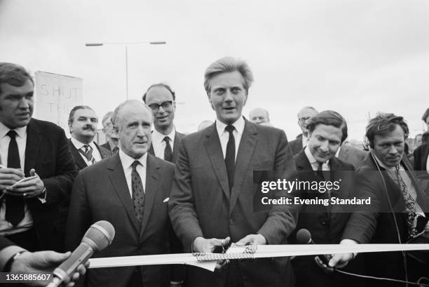 British Conservative Party politician Michael Heseltine, Parliamentary Secretary to the Ministry of Transport, officiates at the official opening of...