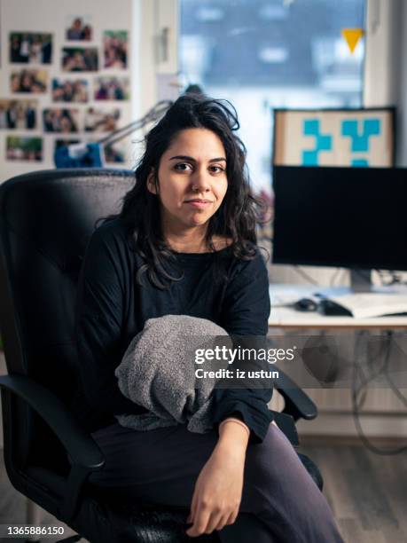 woman sitting in home - couch potato imagens e fotografias de stock