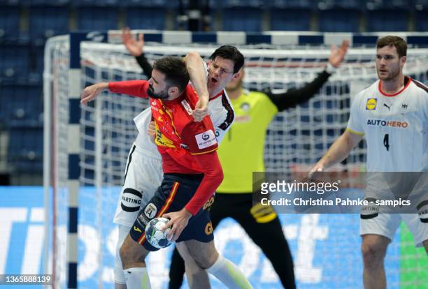 Simon Ernst of Germany vies with Jorge Maqueda Pena of Spain during the Men's EHF EURO 2022 Main Round Group 2 match between Germany and Spain at...