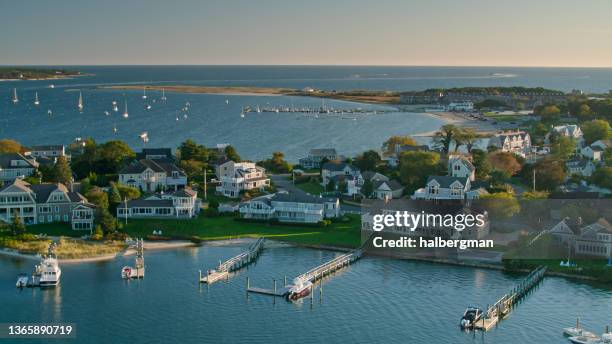 evening sunlight on cape cod houses - aerial - hyannis port stock pictures, royalty-free photos & images