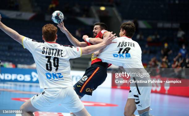 Jorge Maqueda Pena of Spain vies with Julian Koester of Germany and Lukas Stutzke of Germany during the Men's EHF EURO 2022 Main Round Group 2 match...