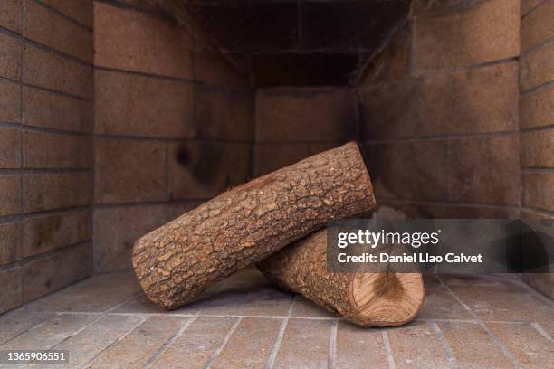 close-up of two unburned wood logs in the fireplace - log stock pictures, royalty-free photos & images