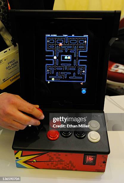 The video game Pac-Man is played on an iCade by Ion Audio during a press event at The Venetian for the 2012 International Consumer Electronics Show...